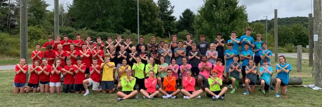 North Andover cross country runners pose together outdoors
