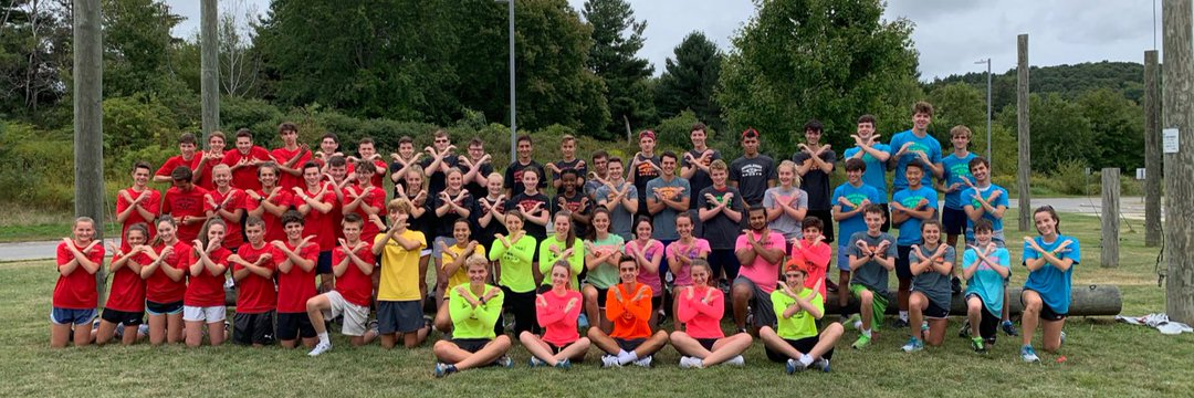 North Andover cross country runners pose together outdoors
